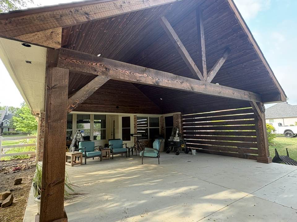 Exterior view of stained gable cover and horizontal slat privacy screen